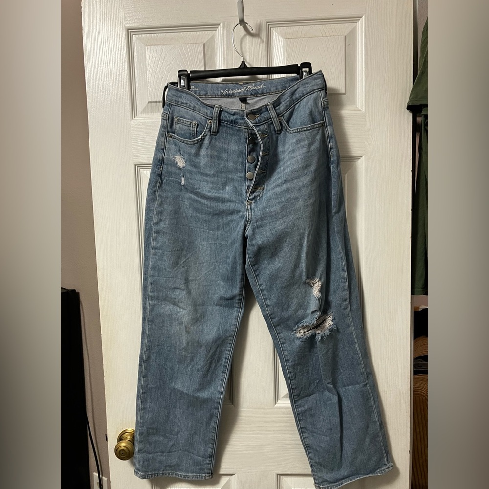 Button fly high waist light wash jeans with knee hole